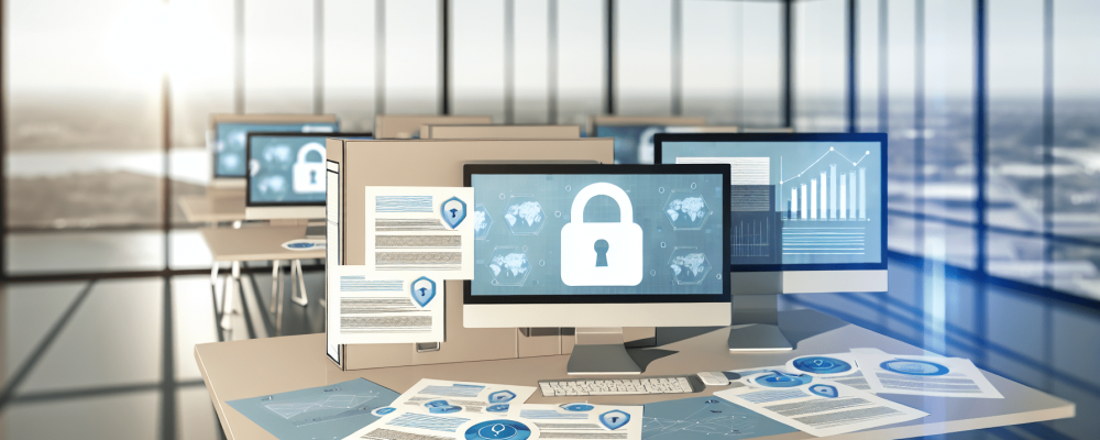 Mesa de escritório moderna em ambiente público com documentos e gráficos de dados em telas, destacando segurança de dados e LGPD.